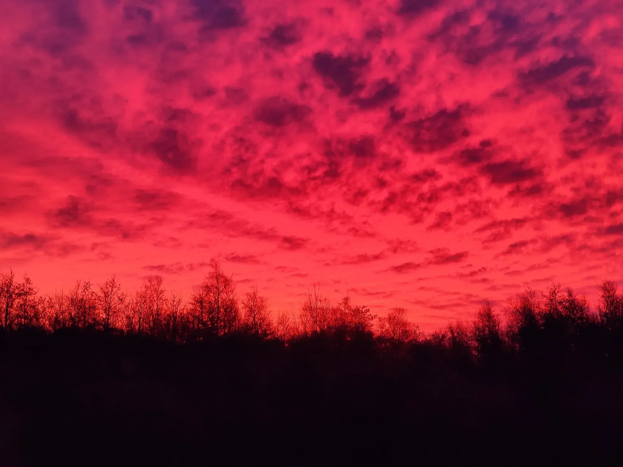 A red sunset over an open field